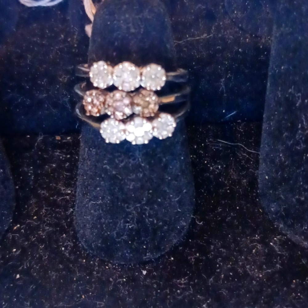 Three diamond rings one is a champagne diamond